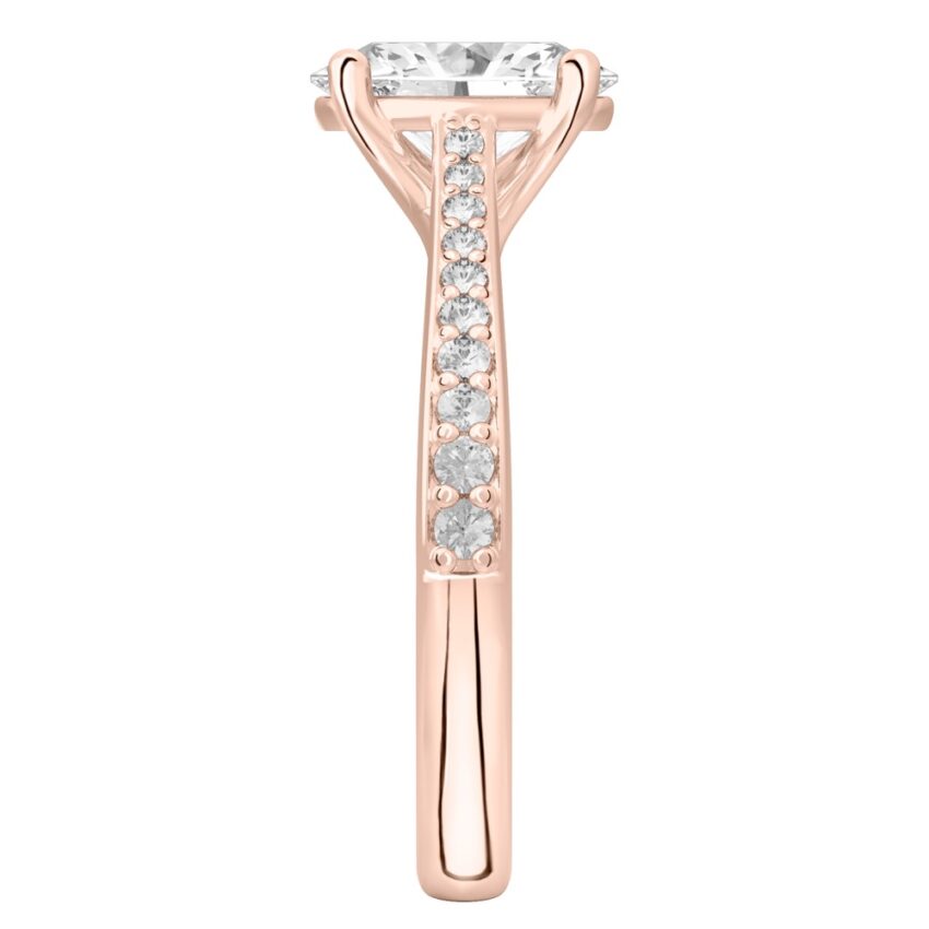Side view of oval shape diamond tapered engagement ring in rose gold