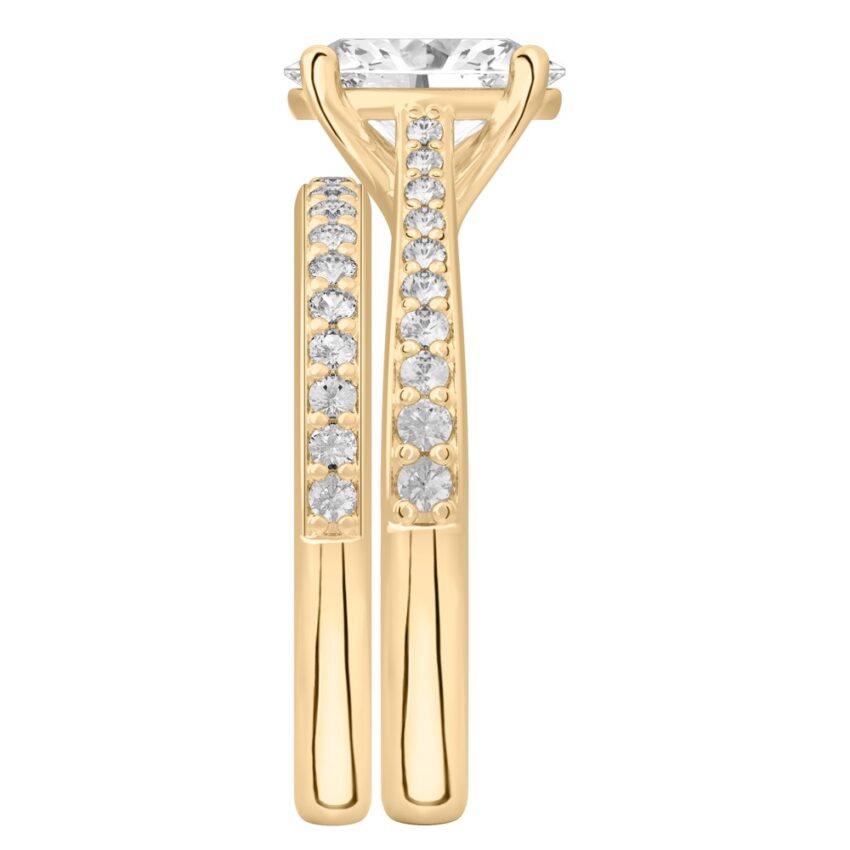 Side view of oval shape diamond tapered engagement ring set yellow gold