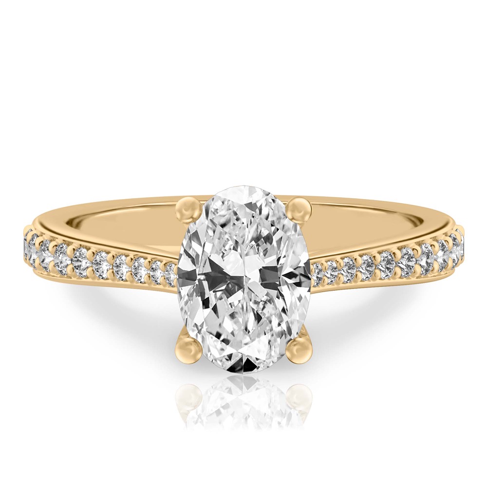 oval shape diamond tapered engagement ring in yellow gold