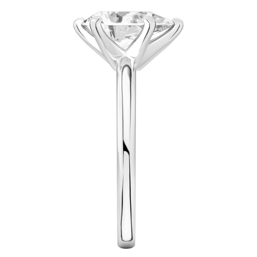 Side view of pear shape diamond classic solitaire engagement ring in palladium