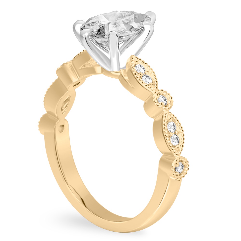 Angle view of pear shape diamond pandora engagement ring in yellow gold