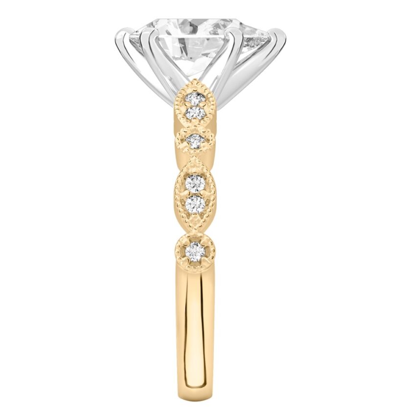 Side view of pear shape diamond pandora engagement ring in yellow gold