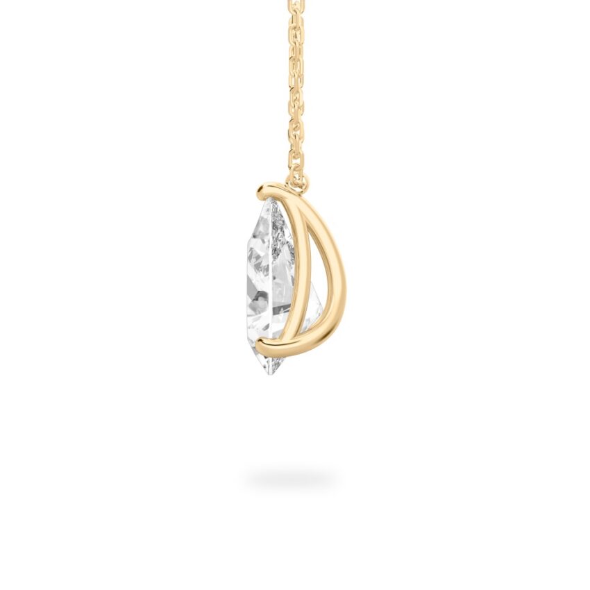 Side view of pear shape diamond pendant necklace in yellow gold