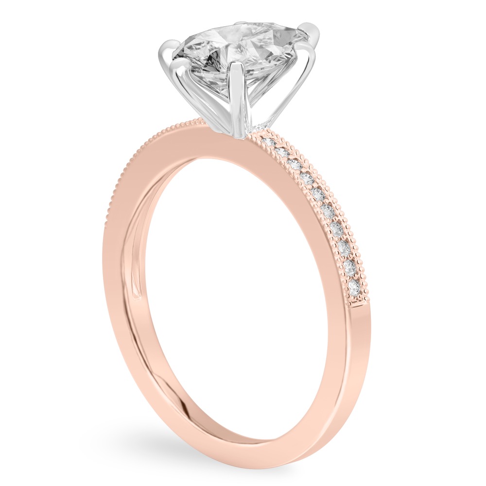 Angle view of pear shape diamond petite milgrain diamond engagement ring in rose gold