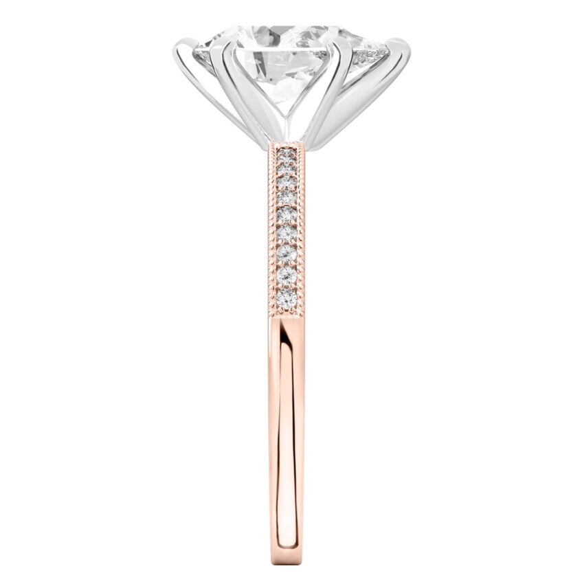 Side view of pear shape diamond petite milgrain diamond engagement ring in rose gold