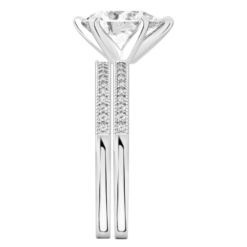 Side view of pear shape diamond petite milgrain diamond engagement ring set palladium