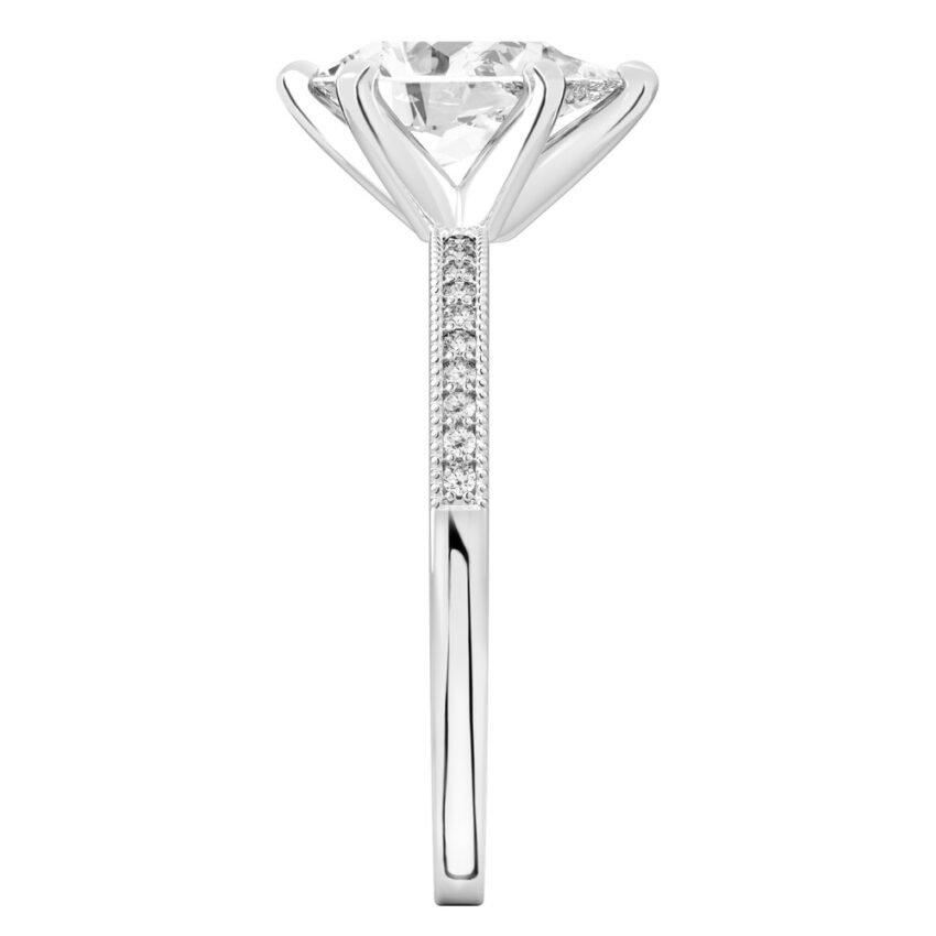Side view of pear shape diamond petite milgrain diamond engagement ring in white gold
