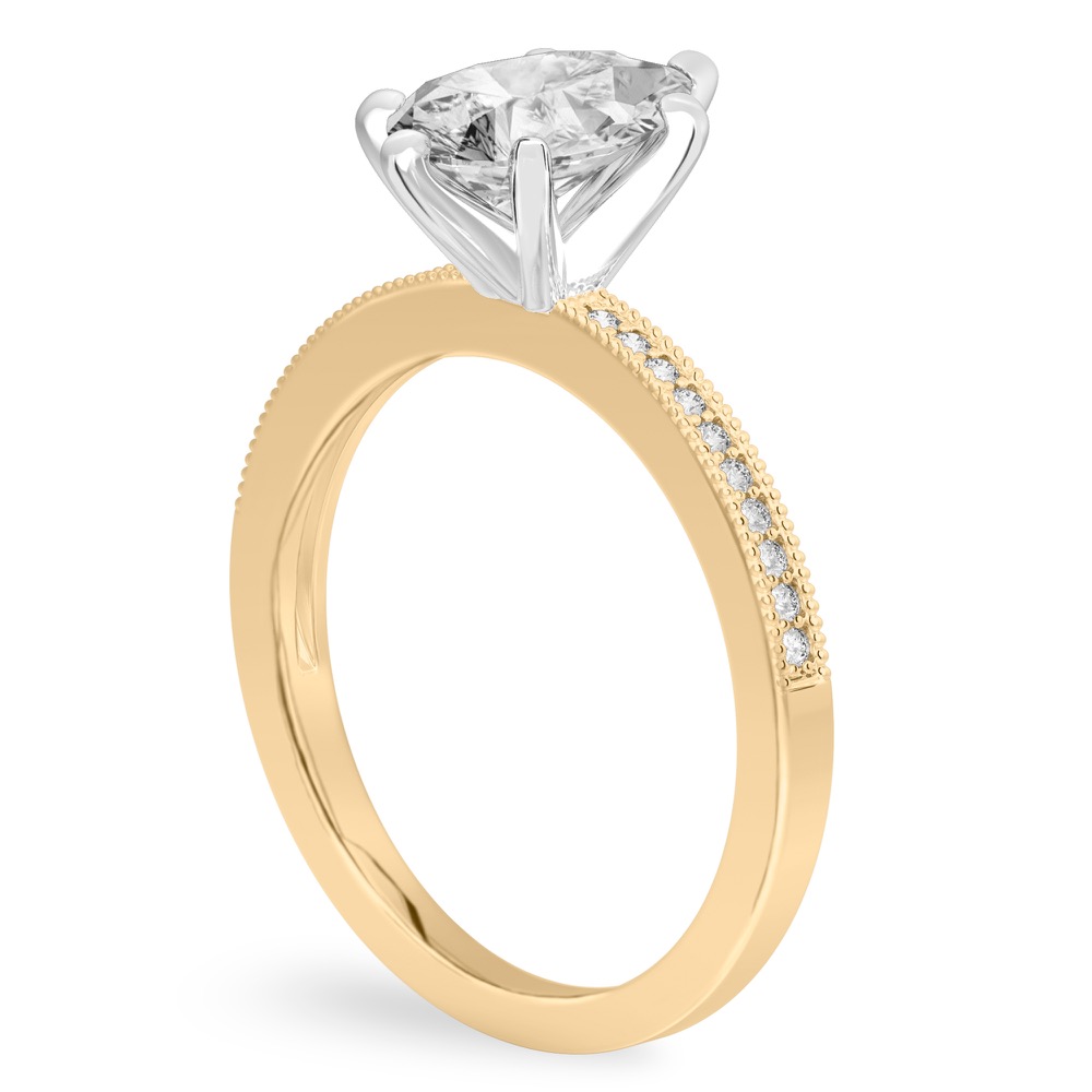 Angle view of pear shape diamond petite milgrain diamond engagement ring in yellow gold