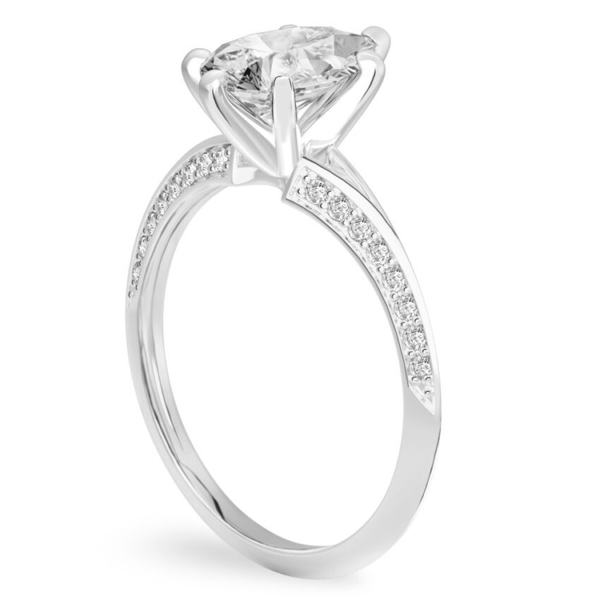 Angle view of pear shape diamond split shank knife edge engagement ring in platinum