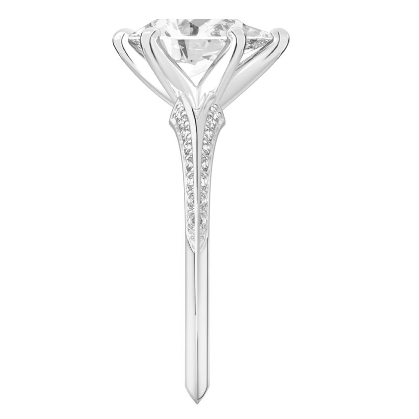 Side view of pear shape diamond split shank knife edge engagement ring in white gold