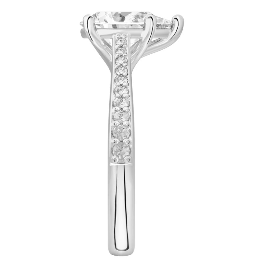 Side view of pear shape diamond tapered engagement ring in platinum