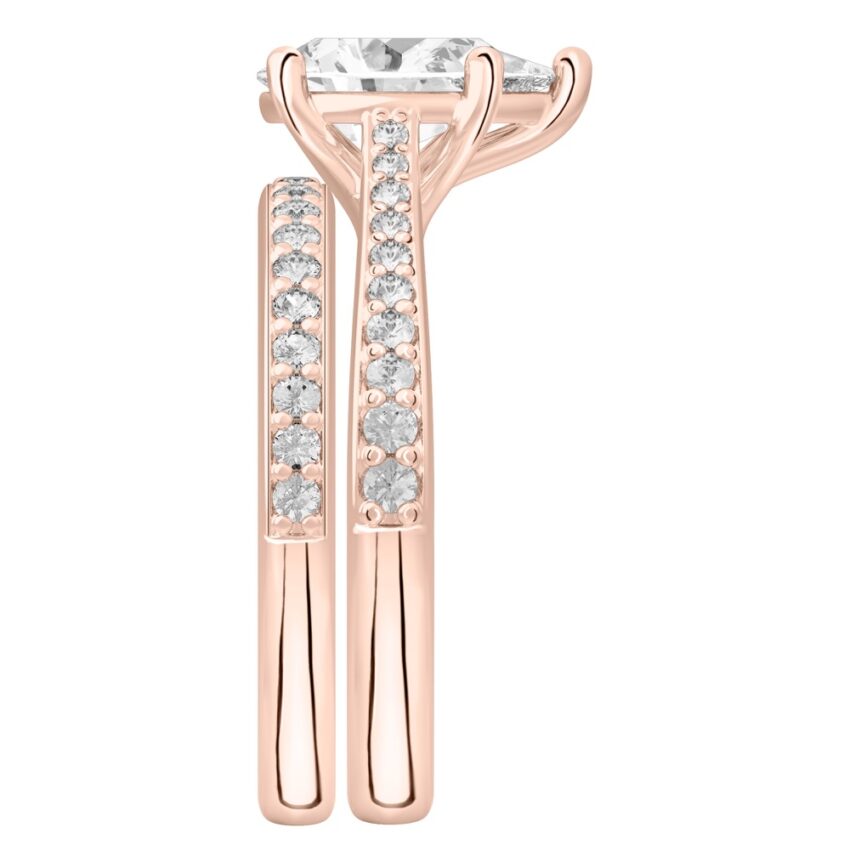 Side view of pear shape diamond tapered engagement ring set rose gold