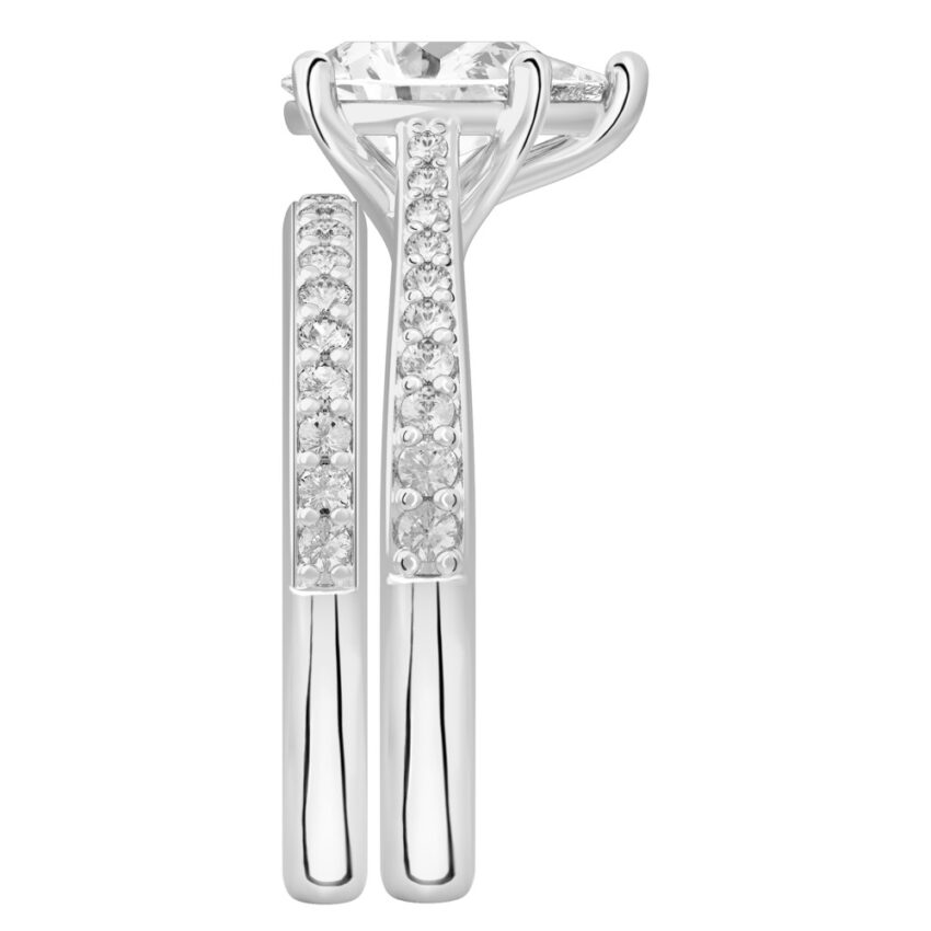 Side view of pear shape diamond tapered engagement ring set white gold