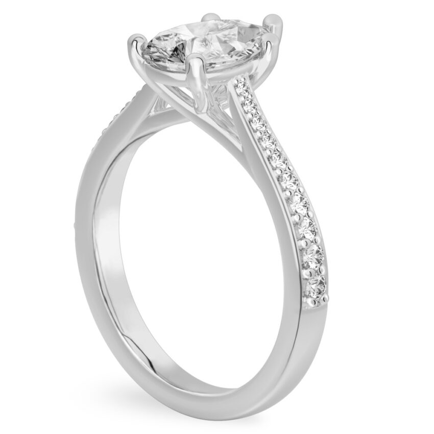 Angle view of pear shape diamond tapered engagement ring in white gold