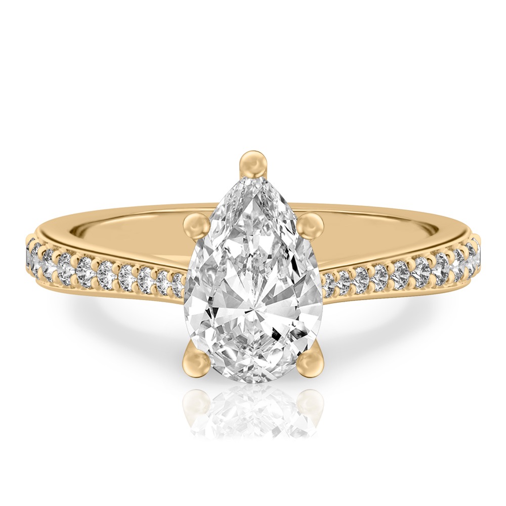 pear shape diamond tapered engagement ring in yellow gold