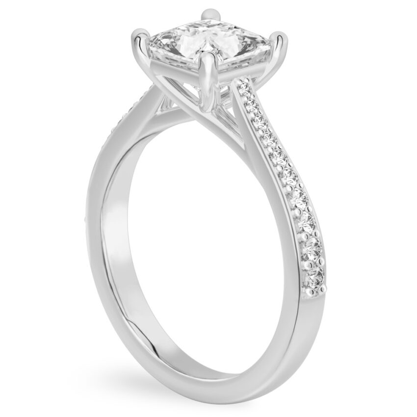 Angle view of princess cut diamond tapered engagement ring in palladium