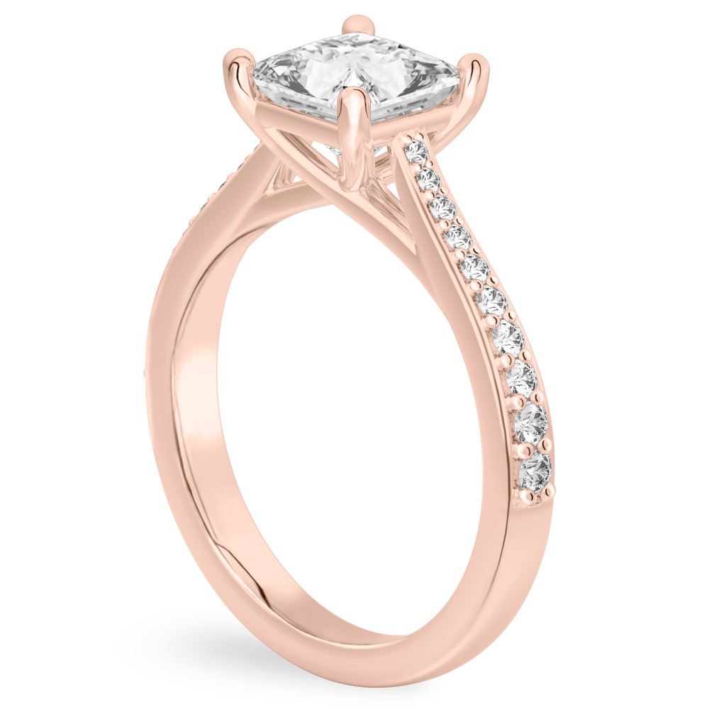 Angle view of princess cut diamond tapered engagement ring in rose gold