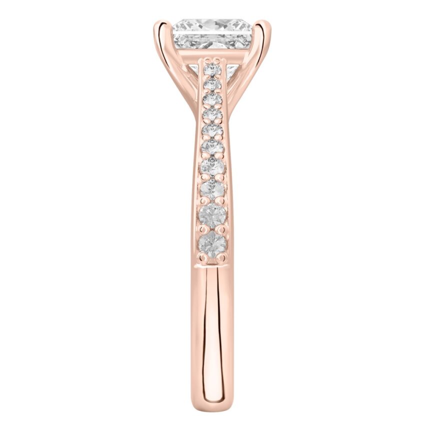 Side view of princess cut diamond tapered engagement ring in rose gold
