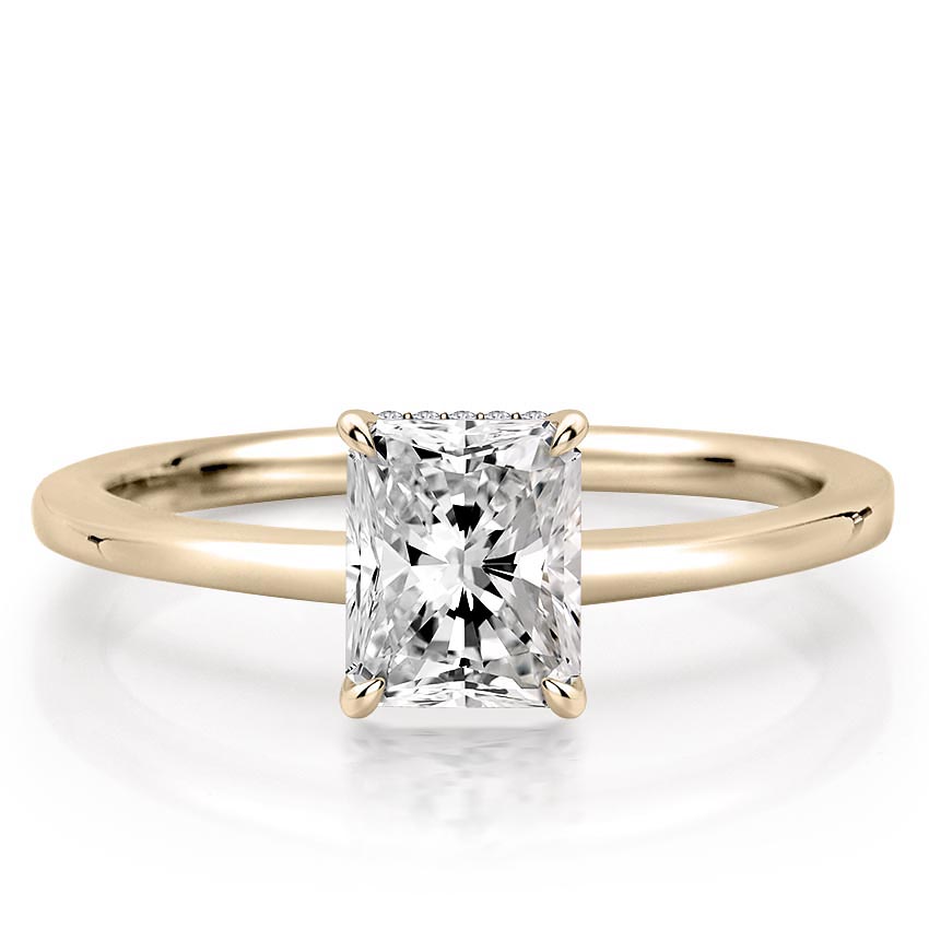 radiant cut diamond secret halo engagement ring in yellow gold