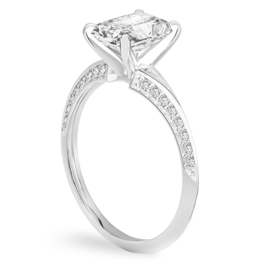 Angle view of radiant cut diamond split shank knife edge engagement ring in platinum