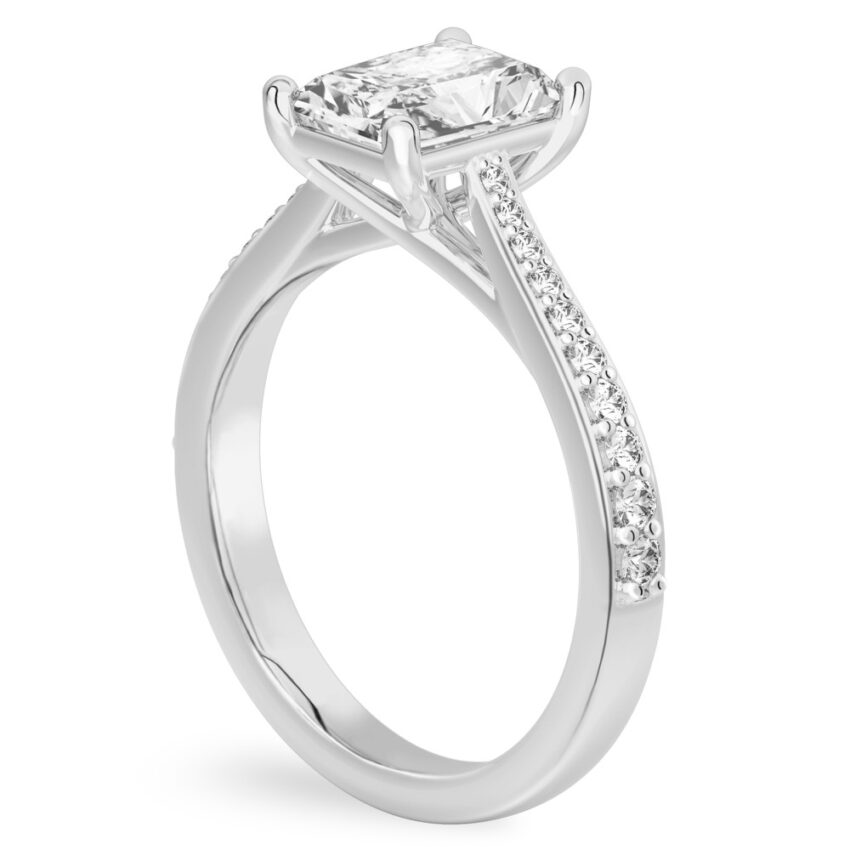 Angle view of radiant cut diamond tapered engagement ring in palladium