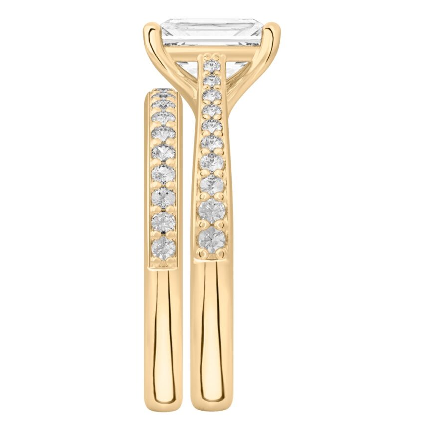 Side view of radiant cut diamond tapered engagement ring set yellow gold