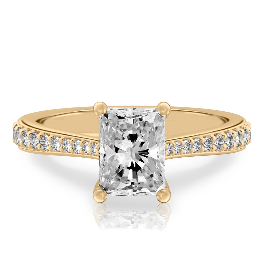 radiant cut diamond tapered engagement ring in yellow gold