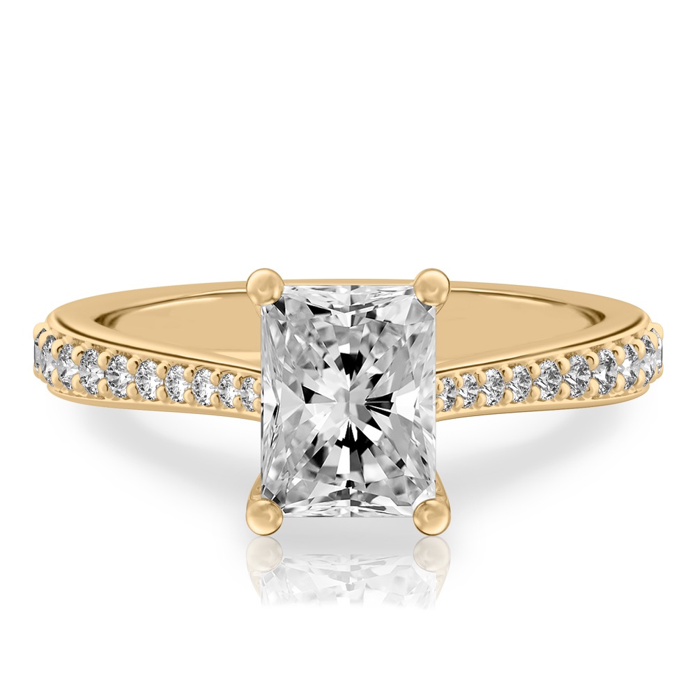 radiant cut diamond tapered engagement ring in yellow gold