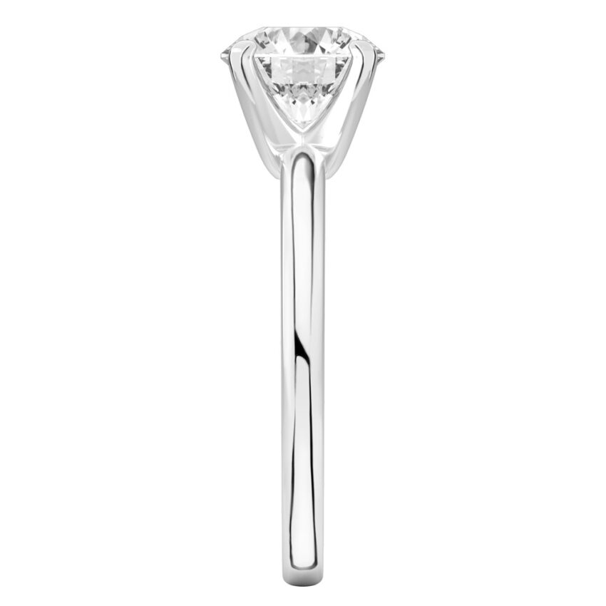 Side view of round cut diamond classic solitaire engagement ring in palladium