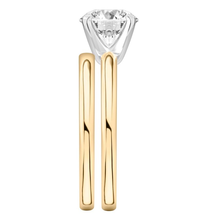 Side view of round cut diamond classic solitaire engagement ring set yellow gold