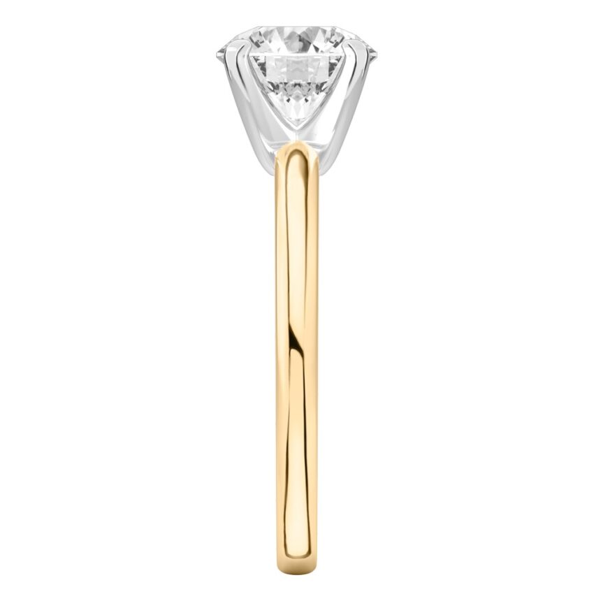 Side view of round cut diamond classic solitaire engagement ring in yellow gold