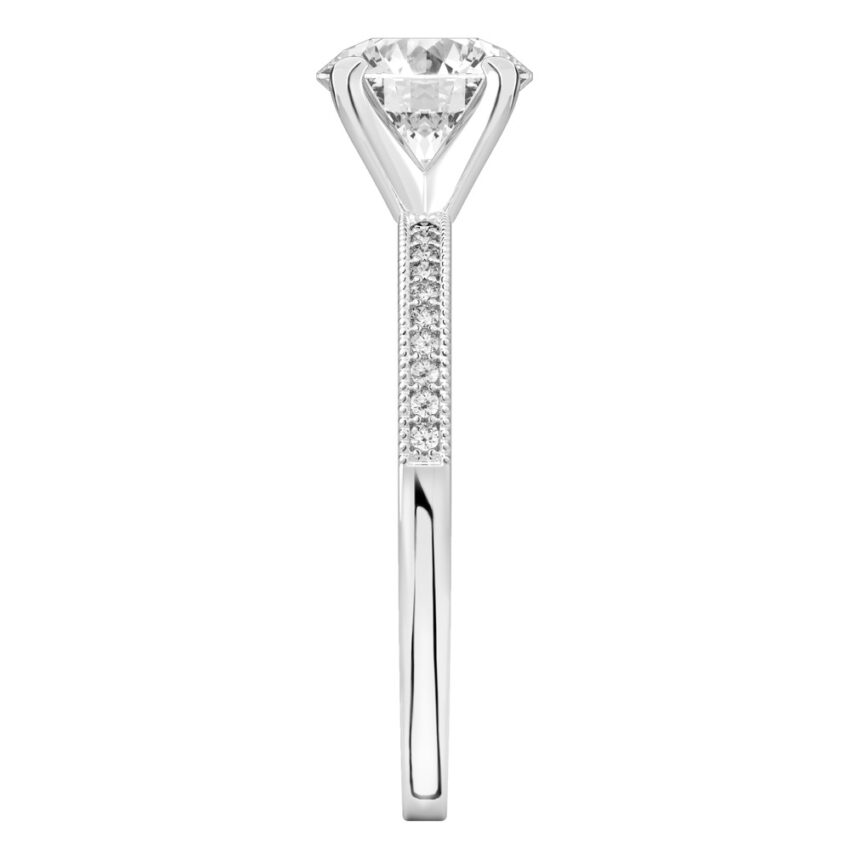 Side view of round cut diamond petite milgrain diamond engagement ring in platinum