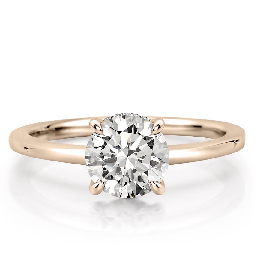 round cut diamond secret halo engagement ring in rose gold