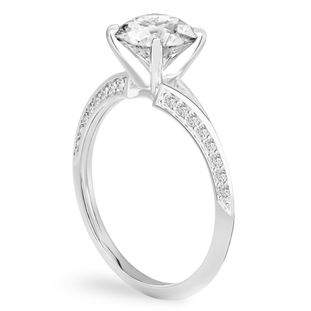 Angle view of round cut diamond split shank knife edge engagement ring in palladium