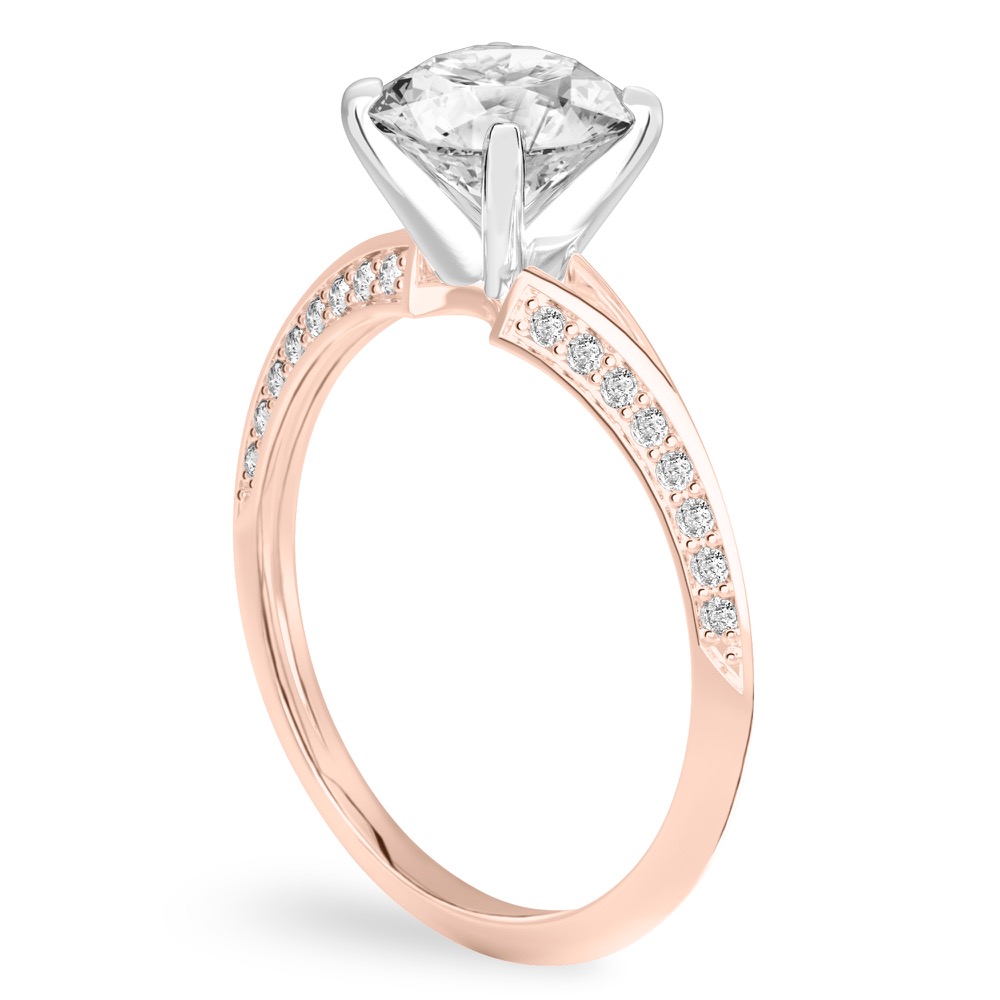 Angle view of round cut diamond split shank knife edge engagement ring in rose gold