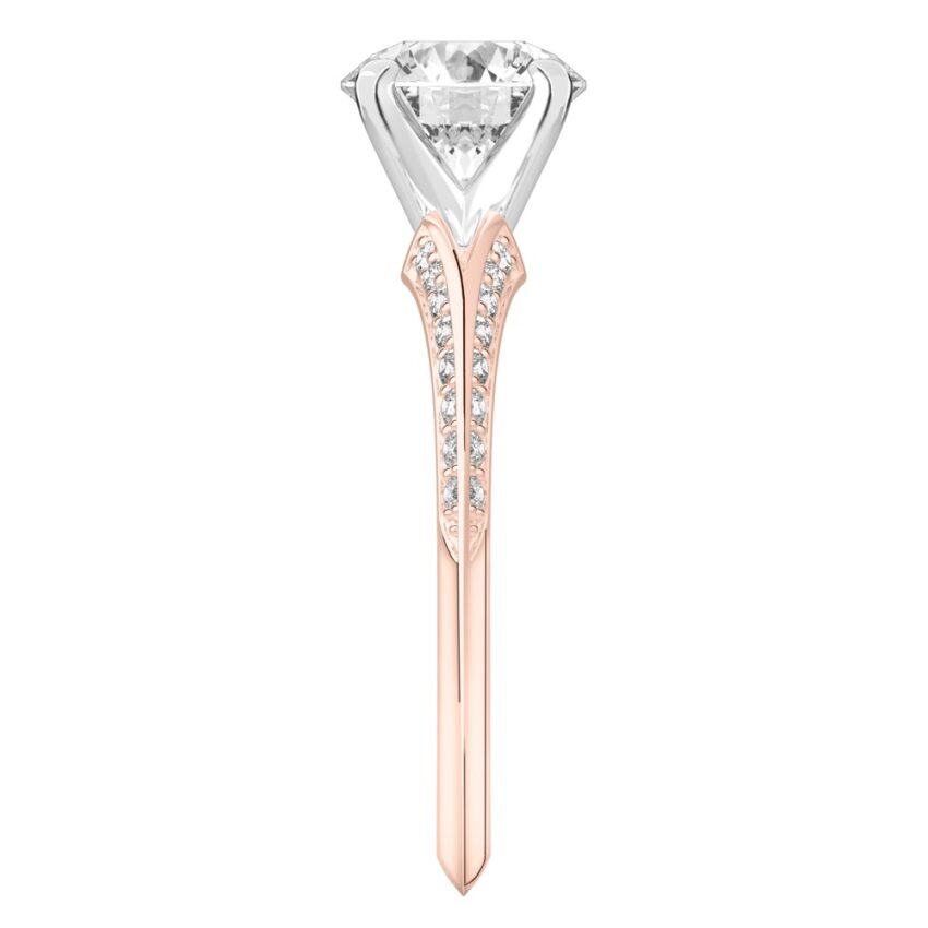 Side view of round cut diamond split shank knife edge engagement ring in rose gold