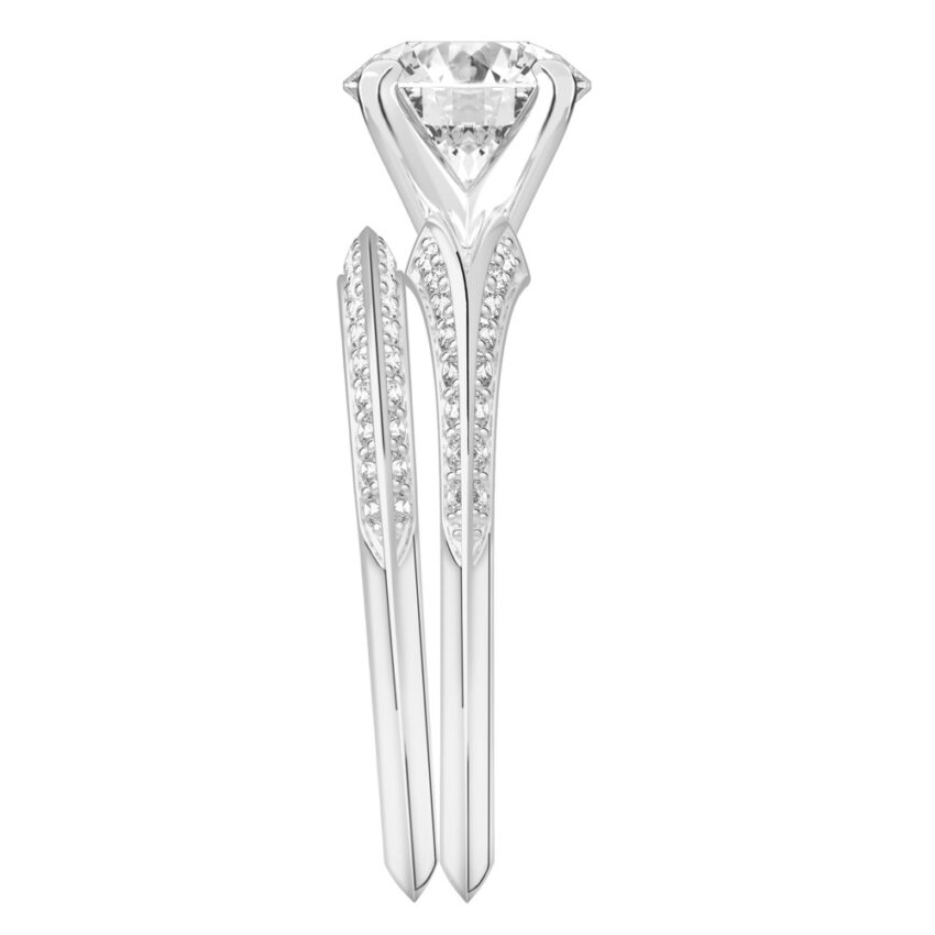 Side view of round cut diamond split shank knife edge engagement ring in set platinum