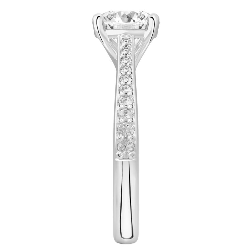 Side view of round cut diamond tapered engagement ring in platinum