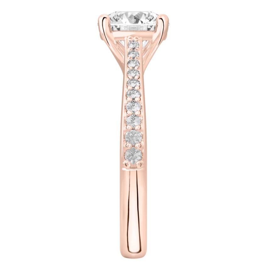Side view of round cut diamond tapered engagement ring in rose gold