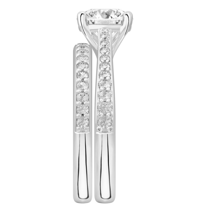 Side view of round cut diamond tapered engagement ring set platinum