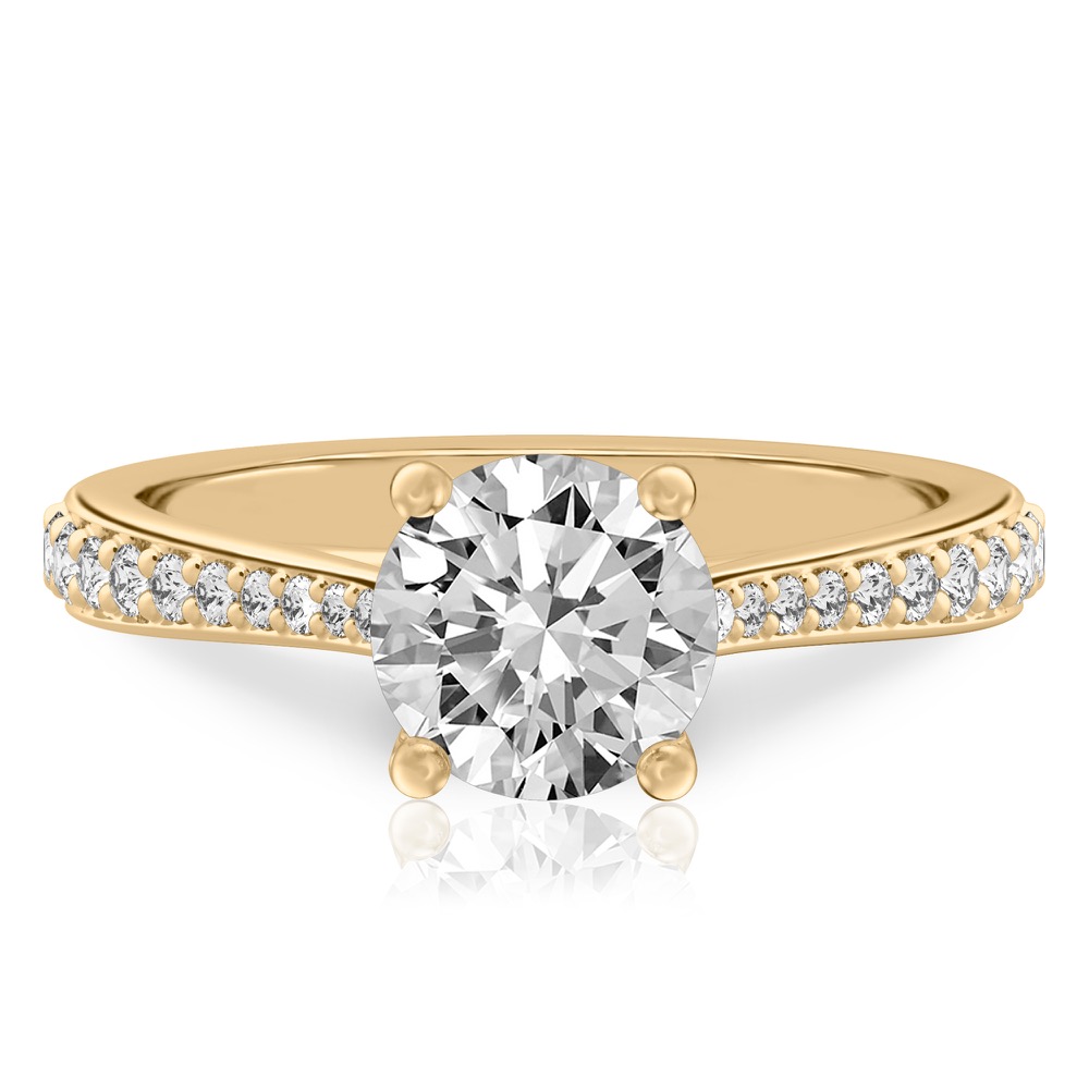 round cut diamond tapered engagement ring in yellow gold