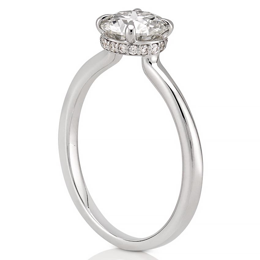 Angle view of secret halo engagement ring in platinum