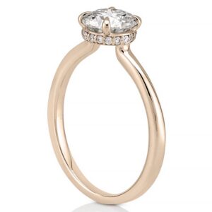 Angle view of secret halo engagement ring in rose gold