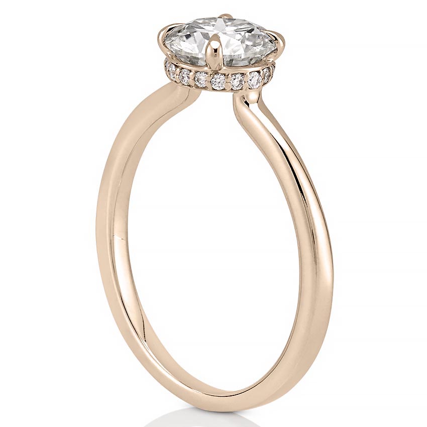 Angle view of secret halo engagement ring in rose gold