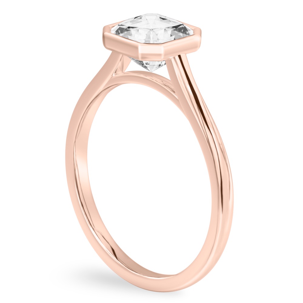 Angle view of asscher cut diamond bezel engagement ring in rose gold