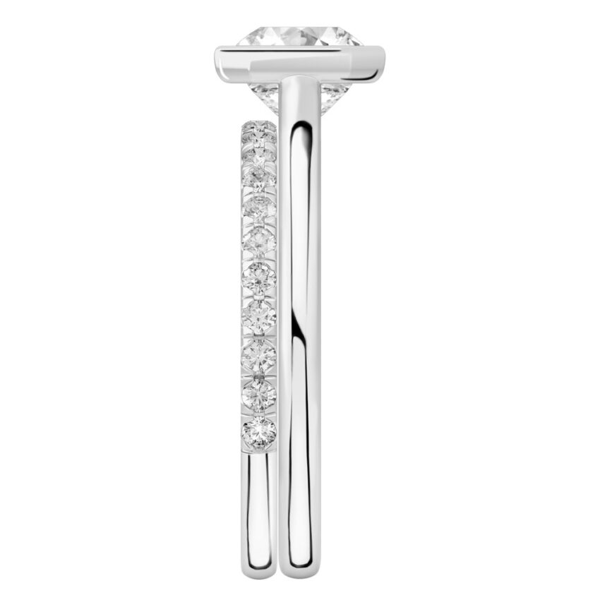 Side view of asscher cut diamond bezel engagement ring set platinum