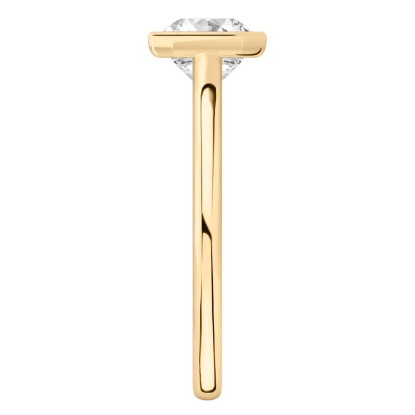 Side view of asscher cut diamond bezel engagement ring in yellow gold