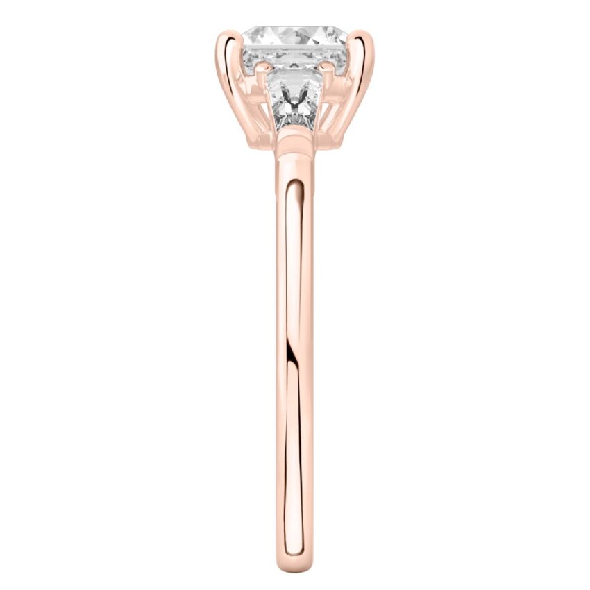 Side view of asscher cut diamond tapered baguette engagement ring in rose gold