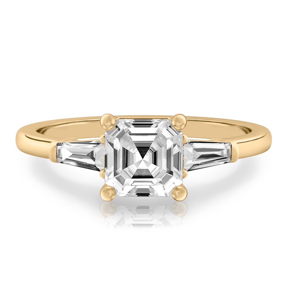 asscher cut diamond tapered baguette engagement ring in yellow gold