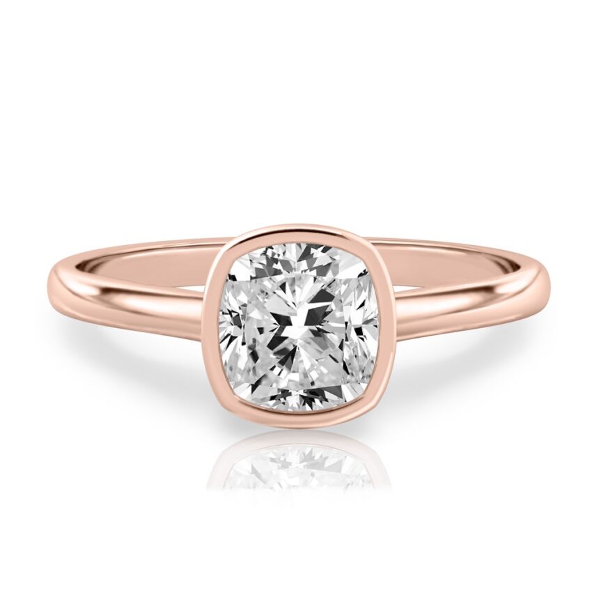 cushion cut diamond bezel engagement ring in rose gold